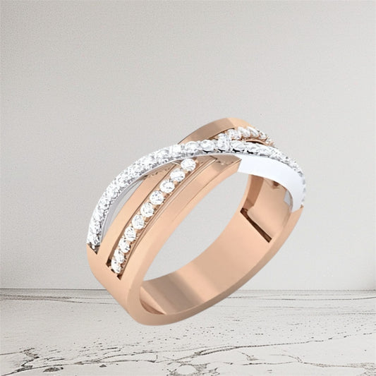 Rose gold and silver ring with diamond accents on a light gray background
