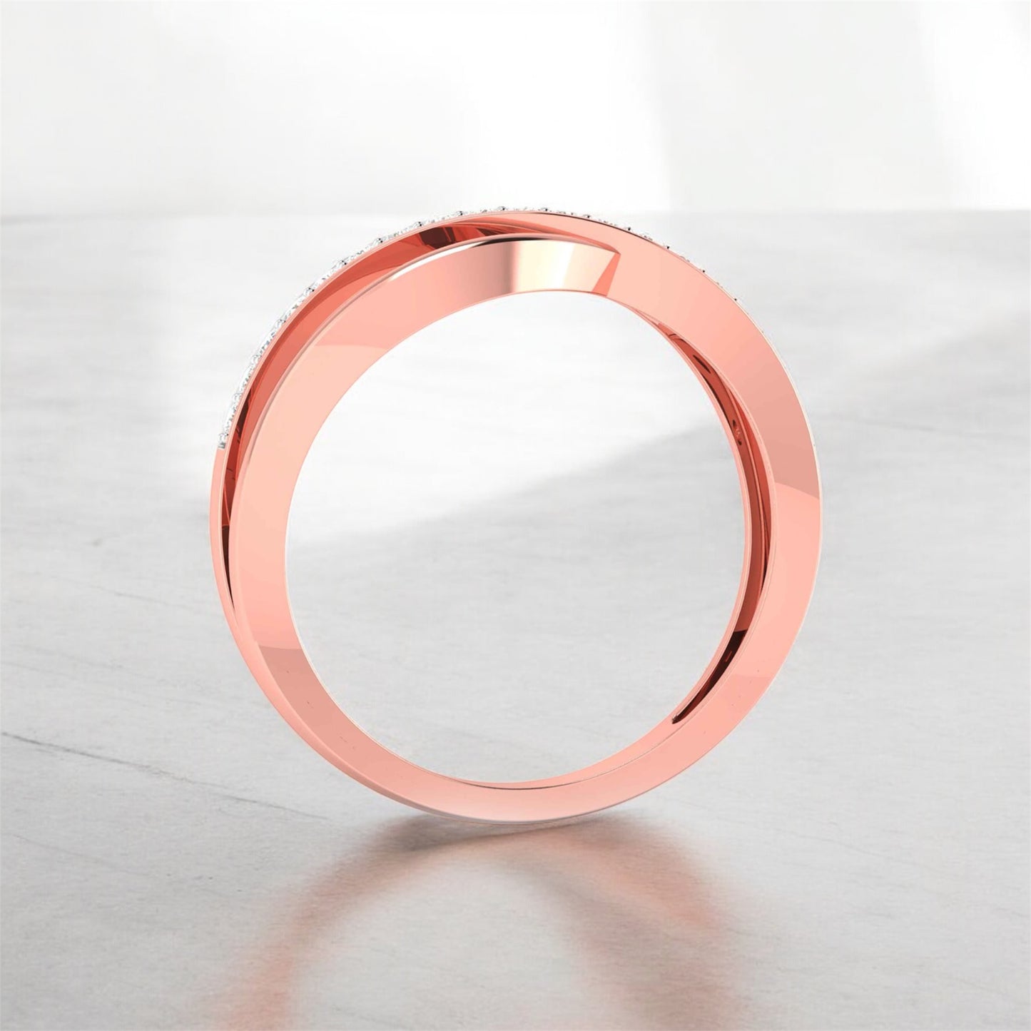 Rose gold ring on a light gray background