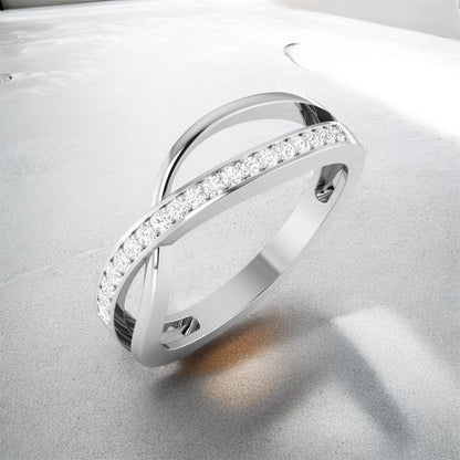 white gold ring with diamond accents on a light gray background