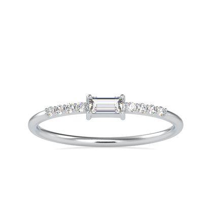 Diamond ring with a central emerald-cut diamond and smaller diamonds on a white background