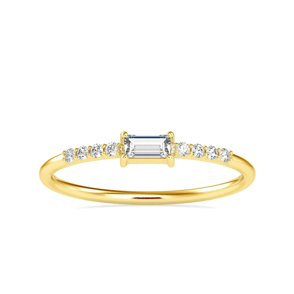 Gold ring with a central diamond and smaller diamonds on a white background