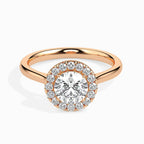 gold ring with a diamond on a white background