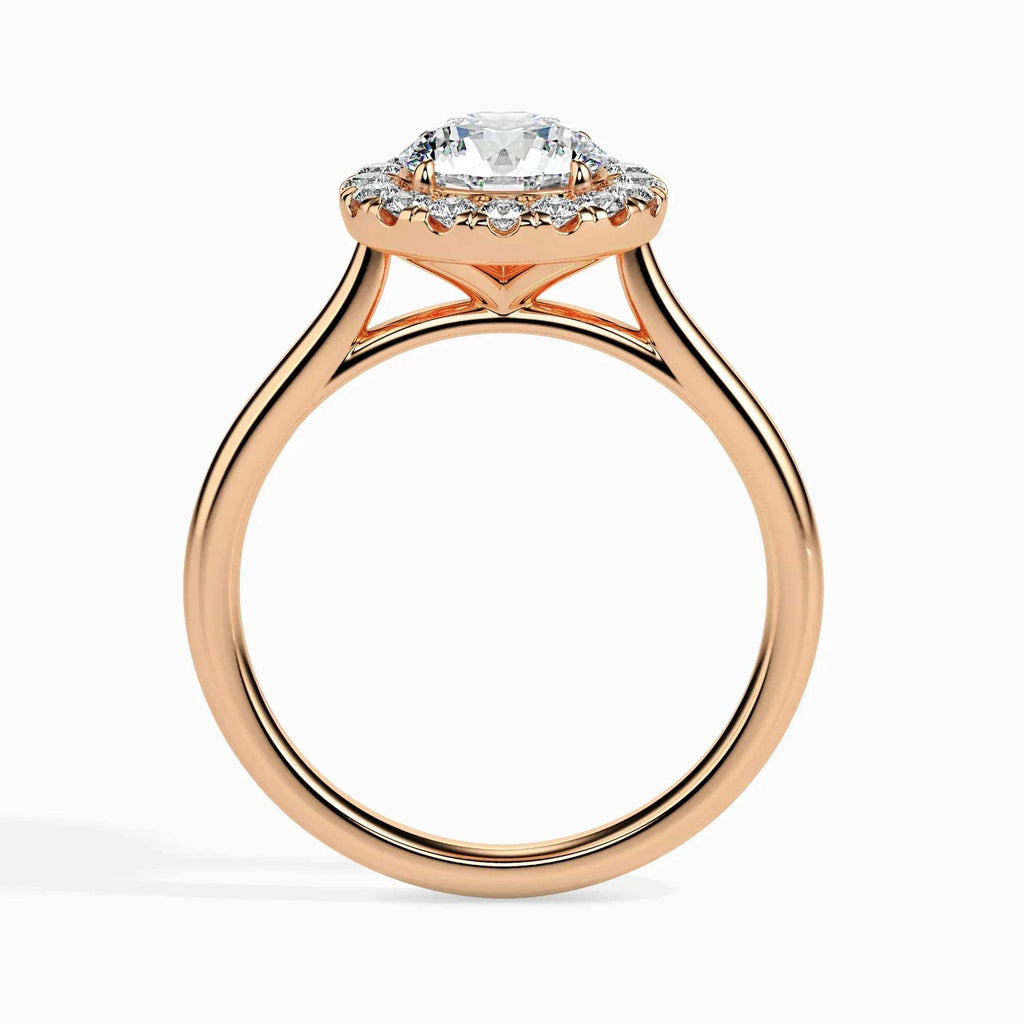 Rose gold ring with a diamond on a white background.