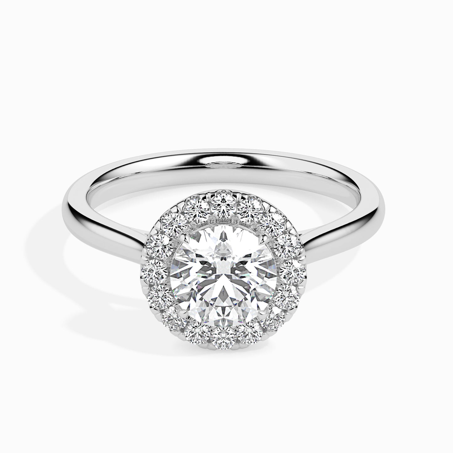 Diamond ring with a halo setting on a white background