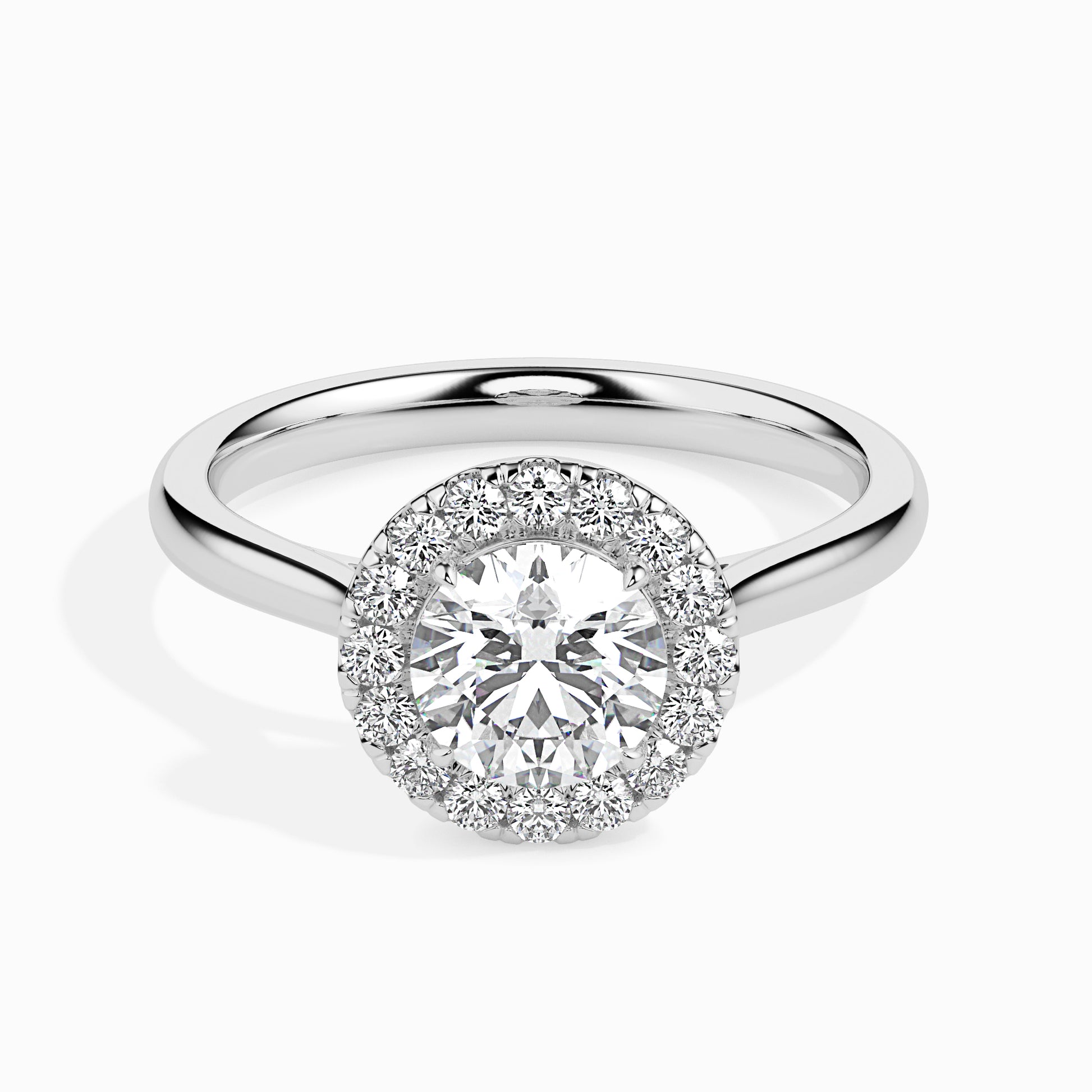 Diamond ring with a halo setting on a white background