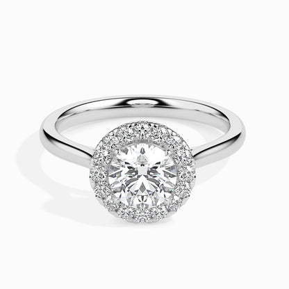 Diamond ring with a halo setting on a white background