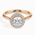 Rose gold ring with a diamond on a white background
