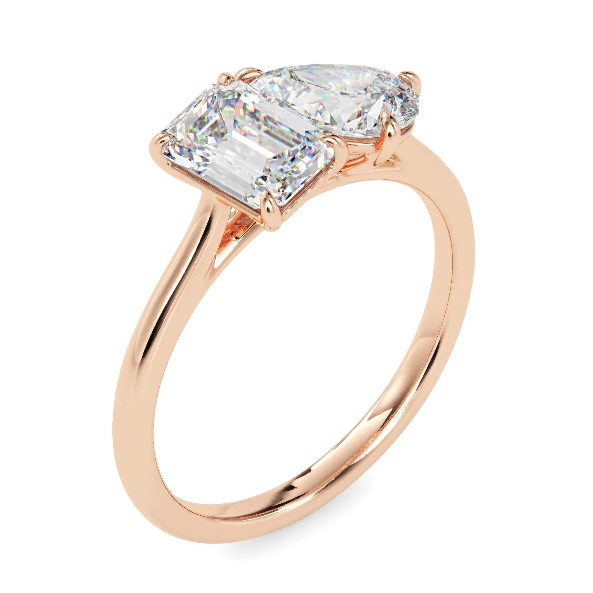 Rose gold ring with two diamonds on a white background