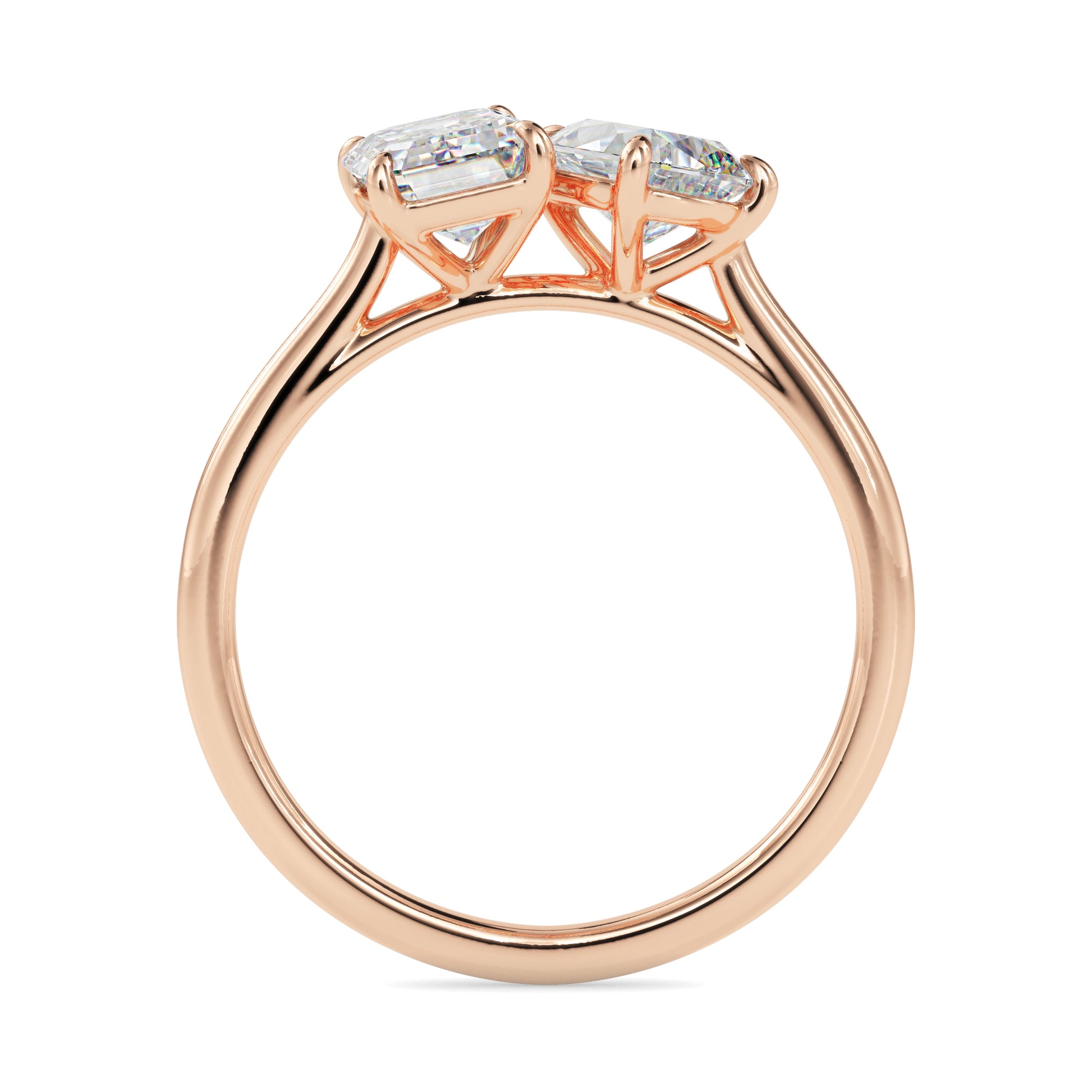Rose gold ring with two diamonds on a white background