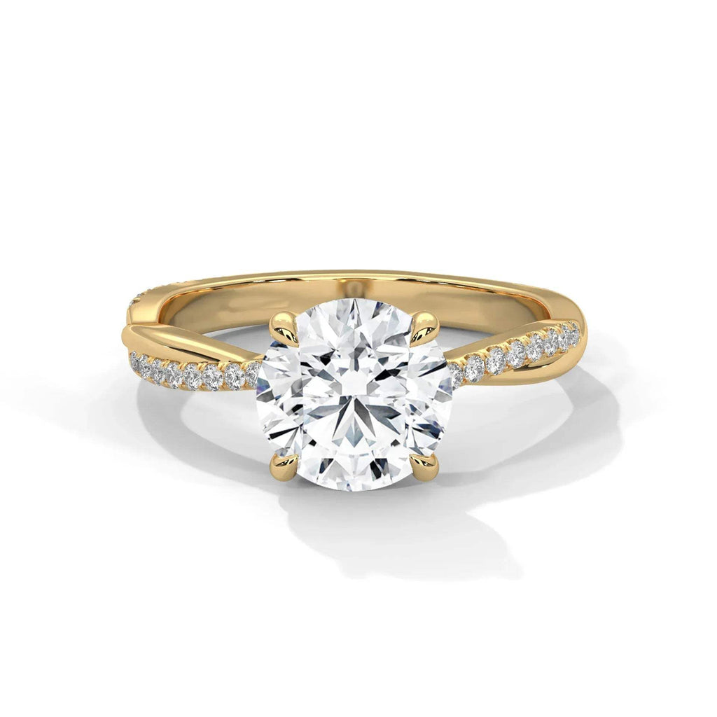 Gold and silver ring with a large diamond and smaller diamonds on the band against a white background