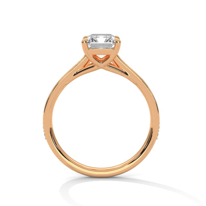 gold ring with a diamond on a white background