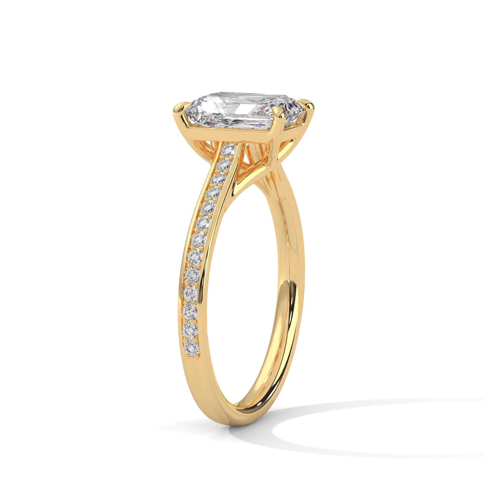 Gold ring with a large diamond and smaller diamonds on the band against a white background