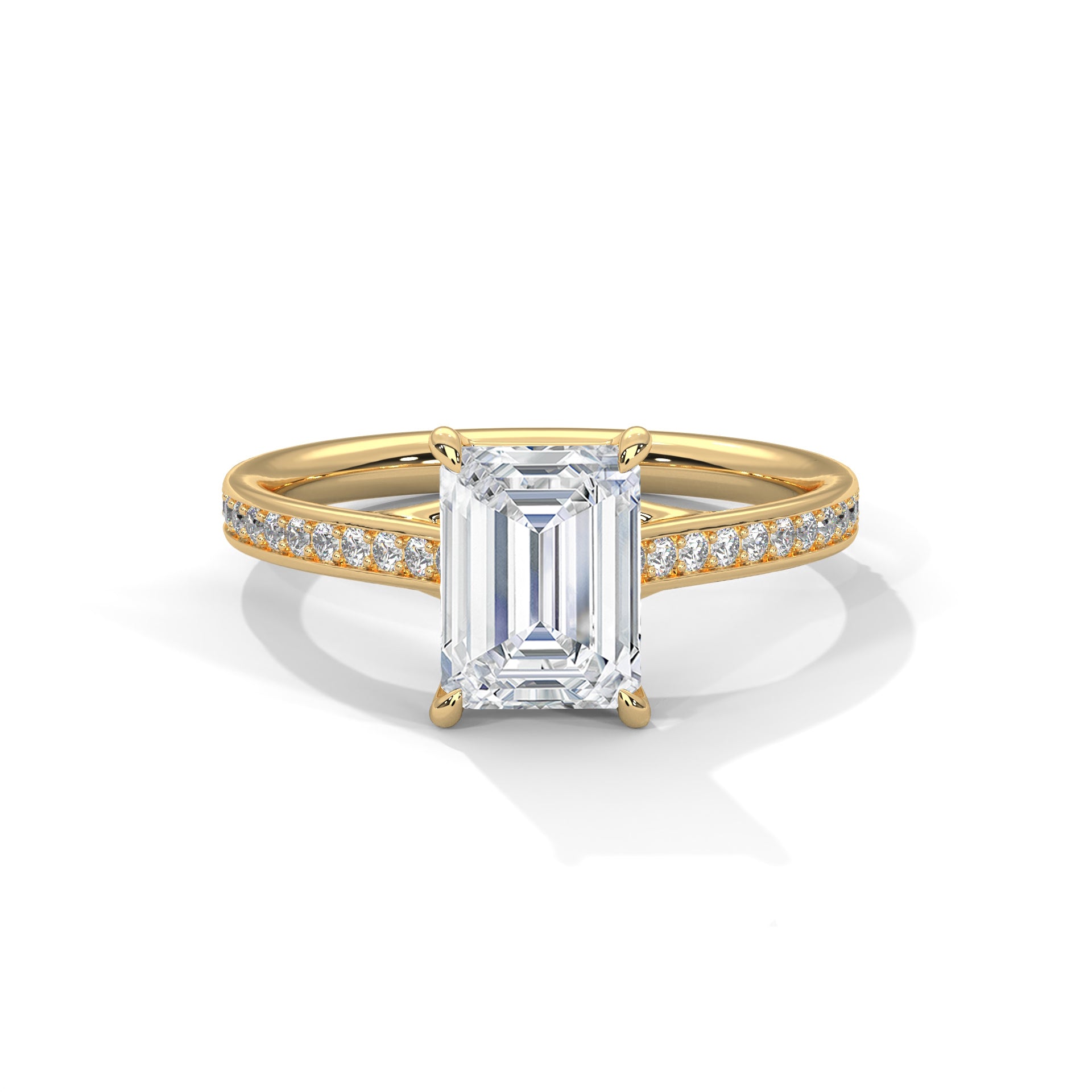 Gold ring with a large emerald-cut diamond and smaller diamonds on the band against a white background.
