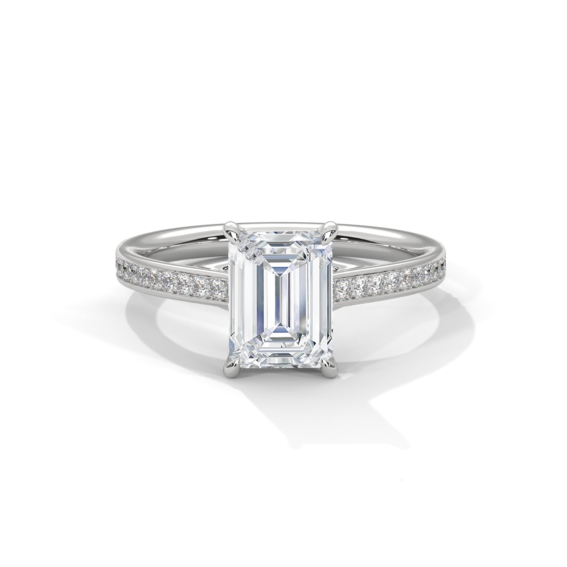 Diamond ring with emerald-cut center stone on a white background