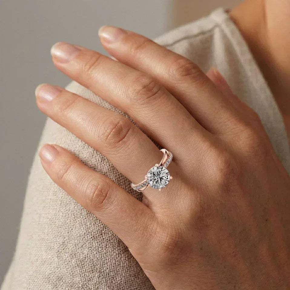 Rose gold real diamond ring on a hand with a neutral background