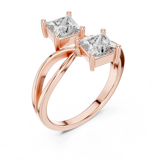 Rose gold ring with two princess-cut diamonds on a white background