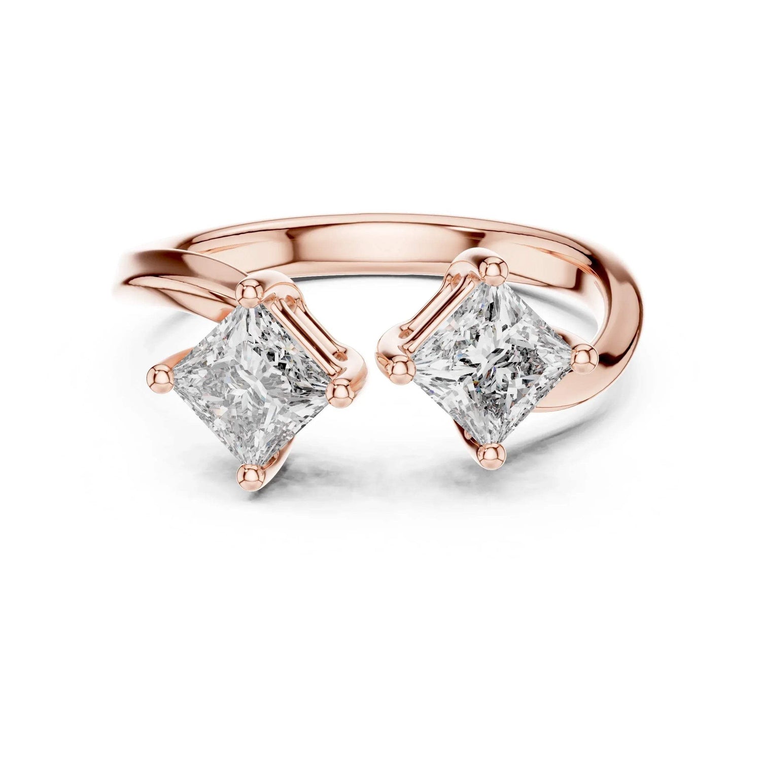 Rose gold ring with two princess-cut diamonds on a white background