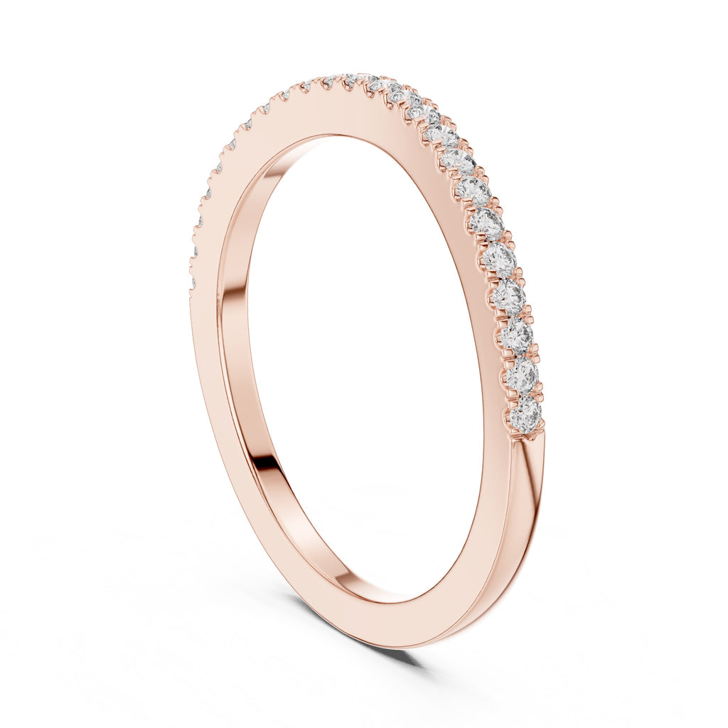 Rose gold ring with small round natural diamonds on a white background
