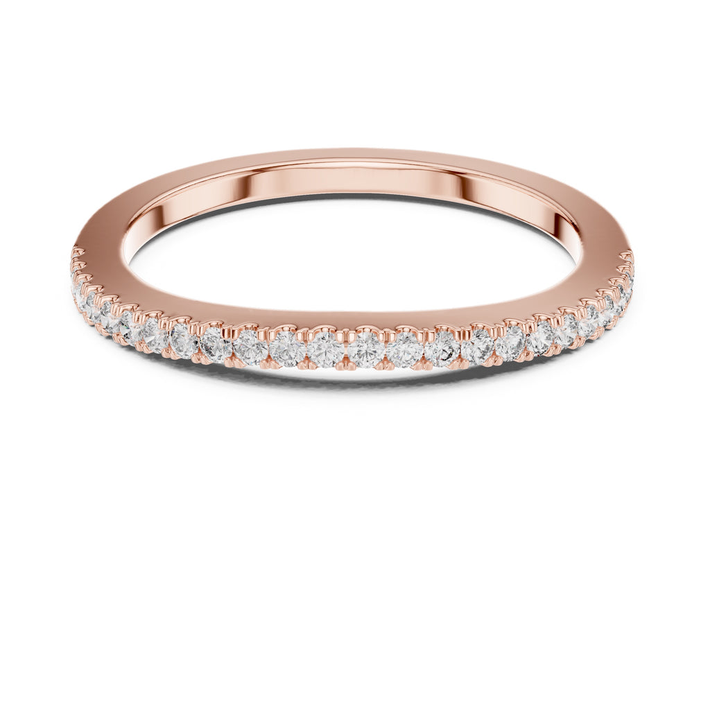 Rose gold ring with natural round diamonds on a white background