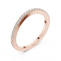 Rose gold ring with small natural round diamonds on a white background