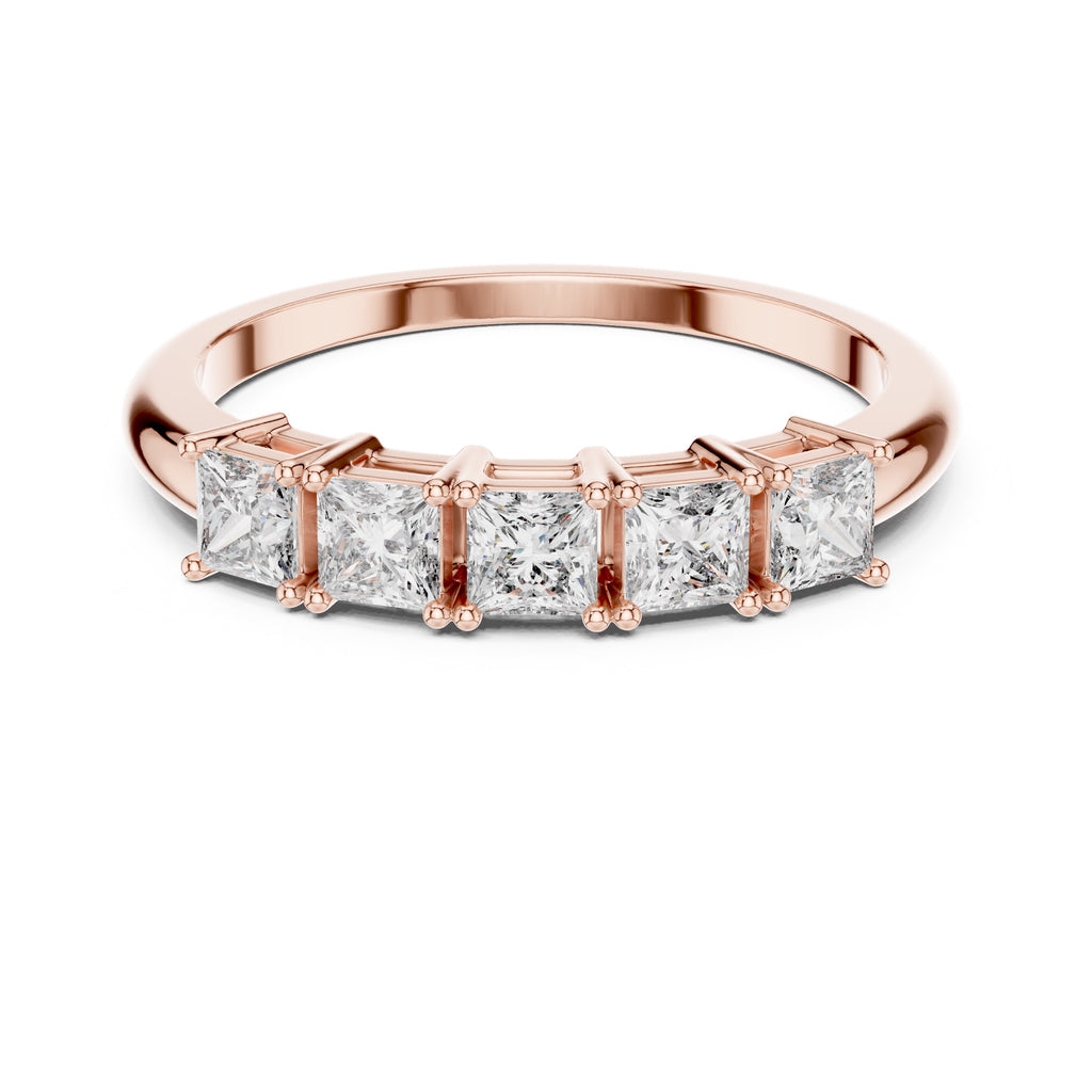 Rose gold ring with five princess cut  diamonds on a white background