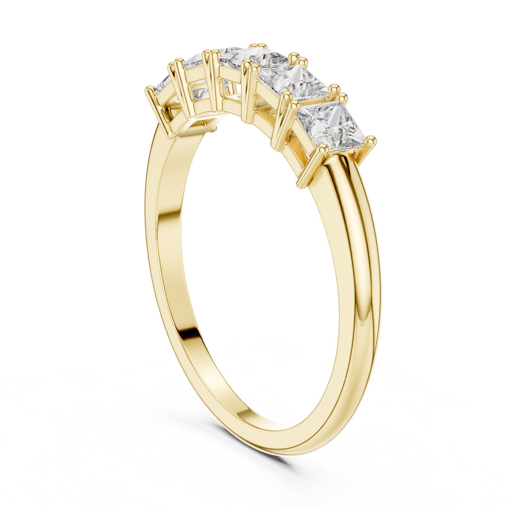 Yellow gold ring with clear diamonds on a white background