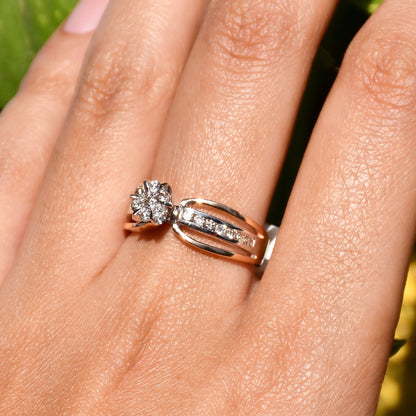 A diamond band ring with 14K gold hallmark, displayed in a hand's middle finger.