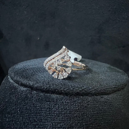 A handcrafted natural diamond solid gold ring displayed on a mannequin bust, with a brilliant cut diamond in a gold band.