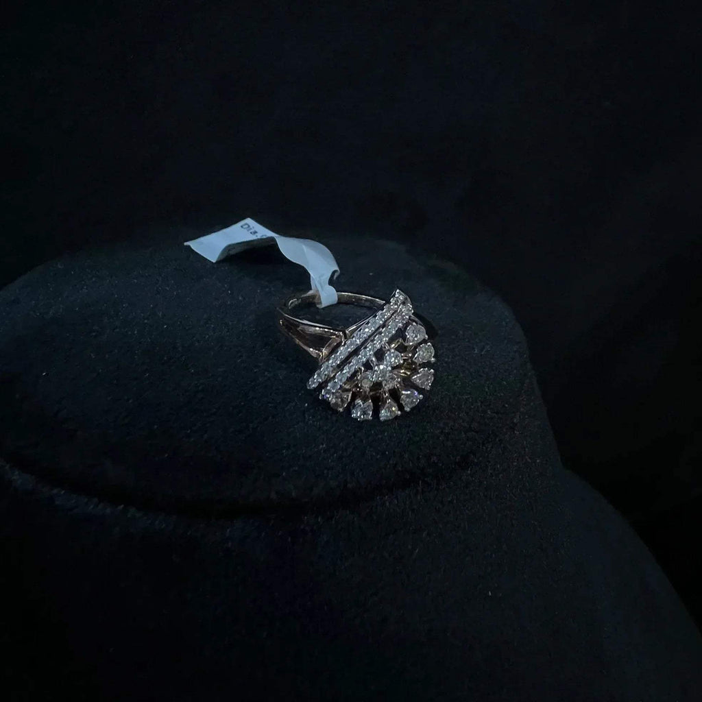 A handcrafted natural diamond solid gold ring displayed on a mannequin bust, with a brilliant cut diamond in a gold band.