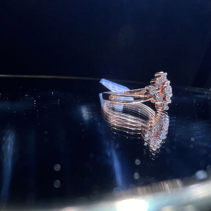 A handcrafted natural diamond solid gold ring, held on a reflective surface, showcasing the ring's design and the shine of the diamonds.